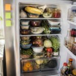 A disorganized assortment of food items in a refrigerator